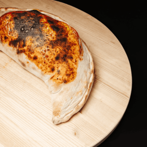 Pizza calzone au jambon et champignons